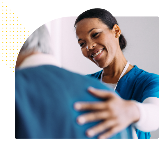 Diverse nurse smiling and helping diverse patient
